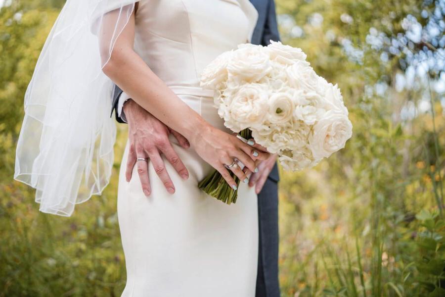 bride and groom holding a bouqet